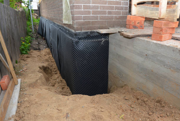 Happy homeowners after waterproofing job in McConnell AFB